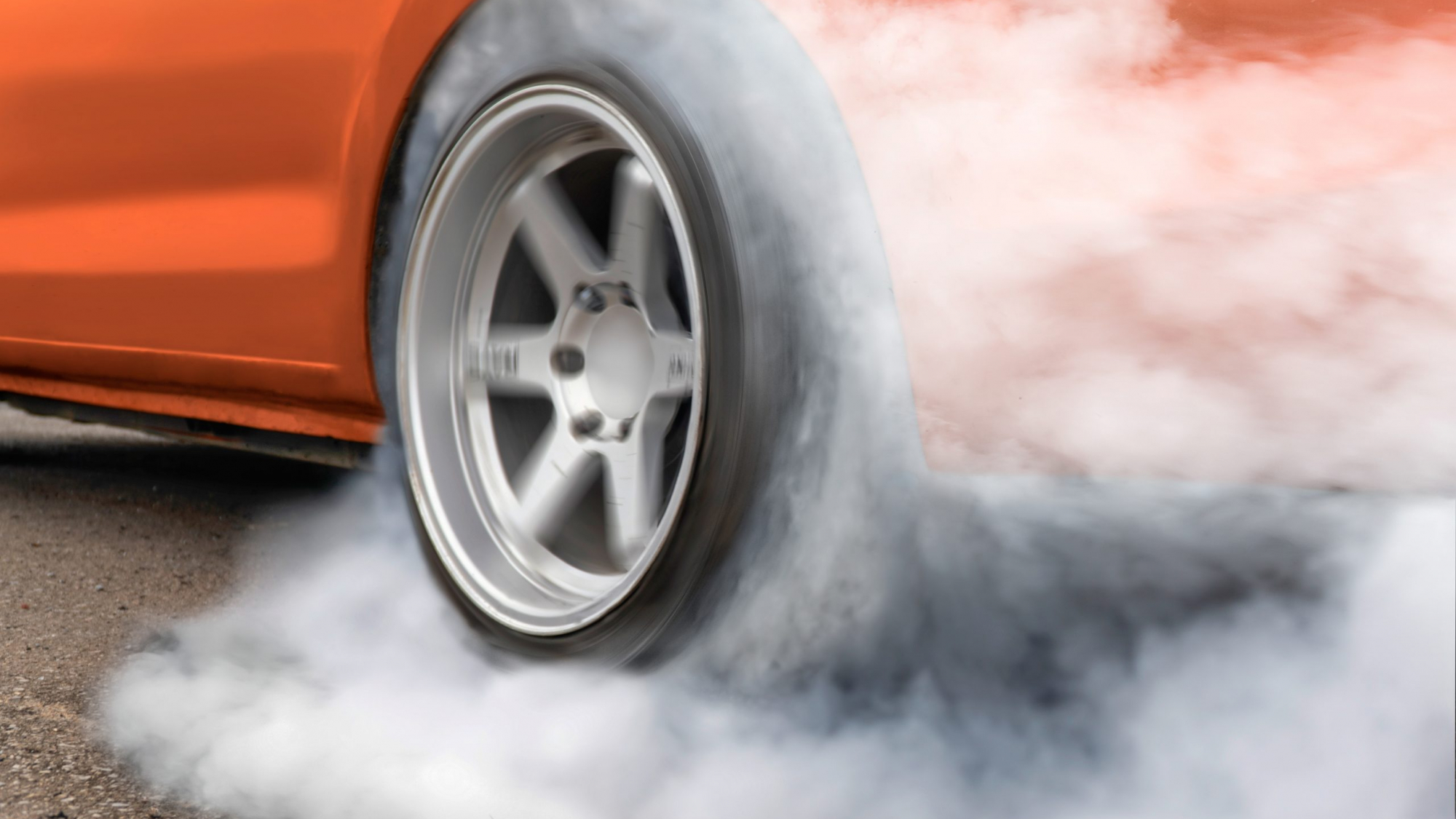 Race drift car burning tires on  playground
