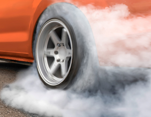 Race drift car burning tires on  playground